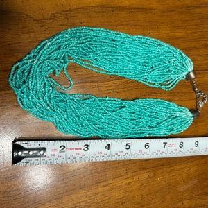 Women’s turquoise beaded necklaces and earrings